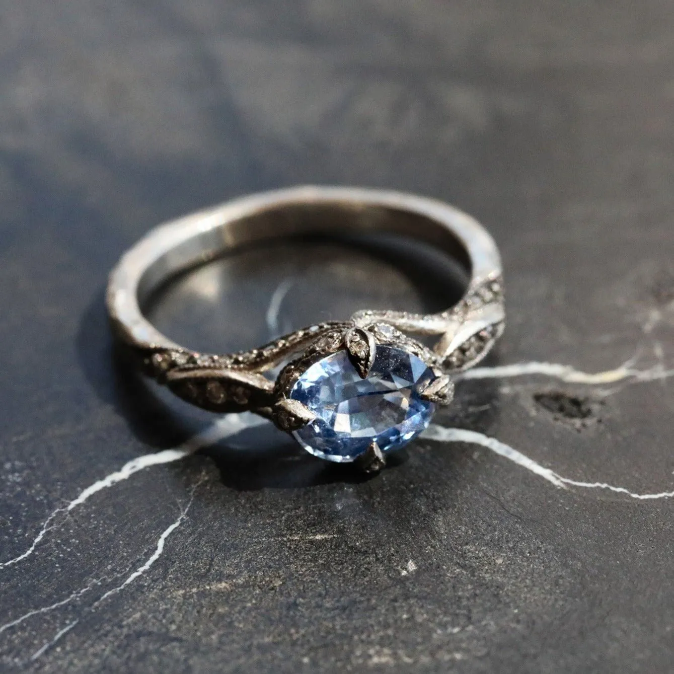 Platinum and Blue Sapphire Petal Side Ring